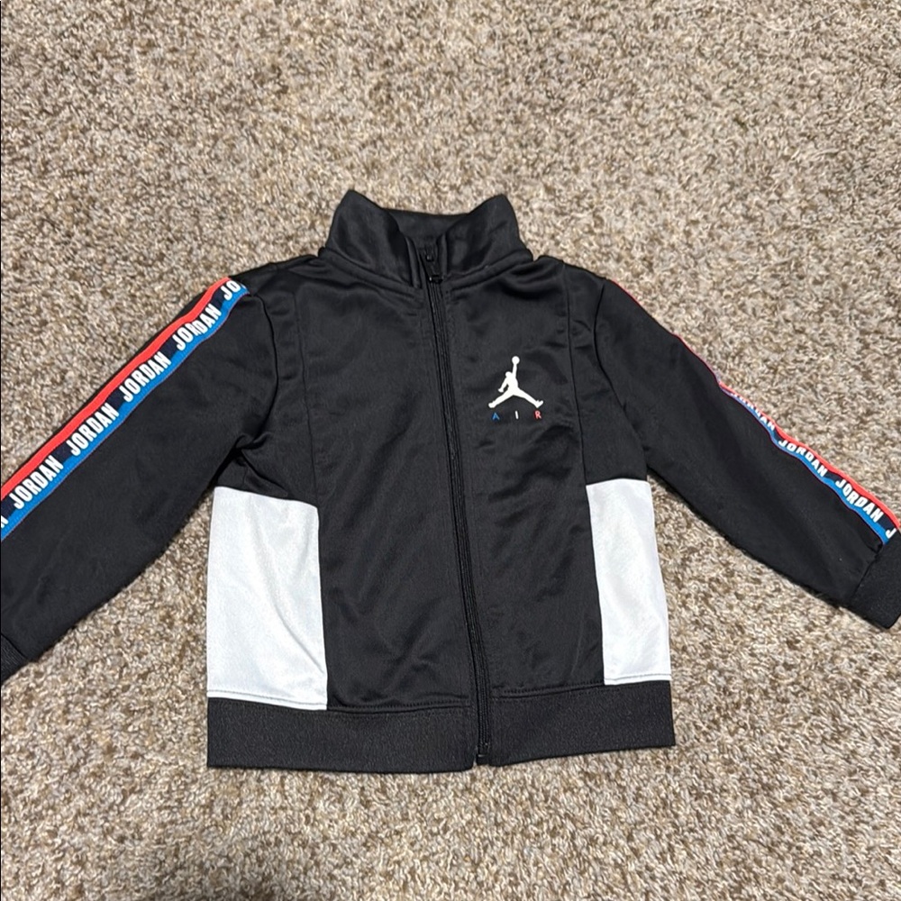 Jordan Black and White Jacket with Blue and Red Accents